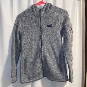 Women’s Patagonia heather gray zip-up fleece.
